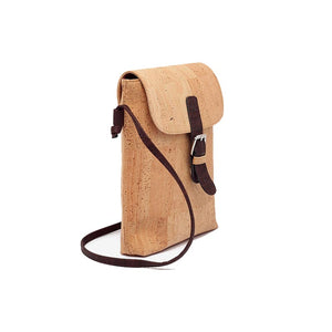 Natural and brown cork cross body bag with buckle, side view