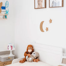 Load image into Gallery viewer, Decorative natural cork wall pieces in the shape of the moon and two stars on a child's bedroom wall.