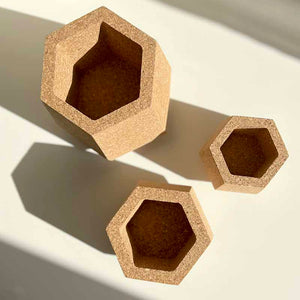 Three hexagonal cork planters / plant pots in different sizes, view from the top