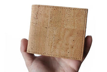 Load image into Gallery viewer, Model holding a natural cork bifold wallet for men