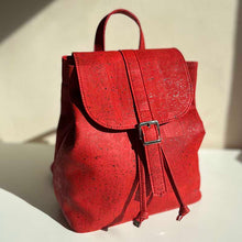 Load image into Gallery viewer, Red cork drawstring backpack with folding top in natural light