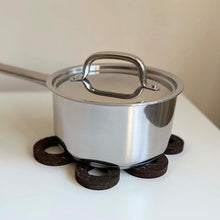 Load image into Gallery viewer, Smoked cork trivet pot stand on a table with a pot
