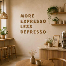 Load image into Gallery viewer, Coffee shop interior with 'More Expresso Less Depresso' wall text with cork wall letters, plants, and coffee-making equipment.