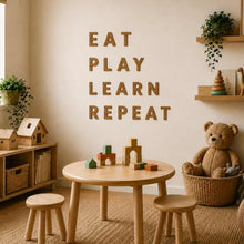 Load image into Gallery viewer, Children's playroom with wooden furniture, toys, and a motivational quote on the wall made with cork wall letters
