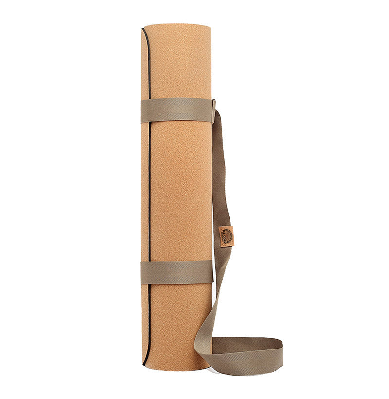 Natural cork yoga mat with olive green shoulder strap