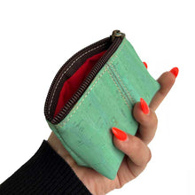Load image into Gallery viewer, Hands holding a mint-green cork purse for coins
