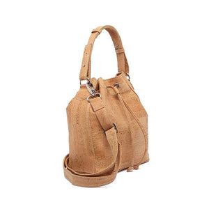Classic natural cork bucket bag with removable handle and adjustable and removable crossbody strap, side view
