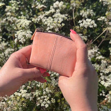 Load image into Gallery viewer, Hands holding a pink cork purse for coins