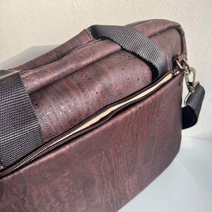 Brown cork laptop bag, front zipper pocket detail