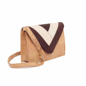 Cork leather envelope crossbody bag with geometric motif in white and brown on the flap, side view