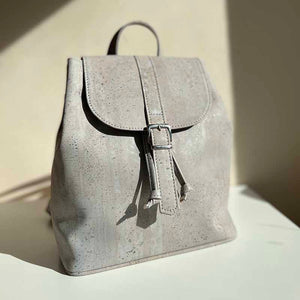 Grey cork drawstring backpack with folding top in natural light