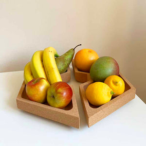 Decorative cork bowl divided in two with fruits