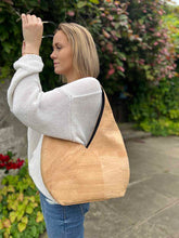 Load image into Gallery viewer, Model carrying the all natural cork hobo bag on her shoulder