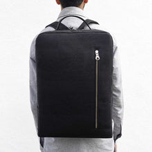Load image into Gallery viewer, Model wearing a large black cork laptop backpack