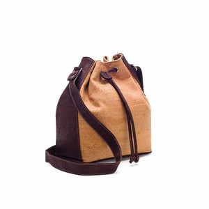 Natural and brown tinted cork fabric bucket bag with drawstring, side view